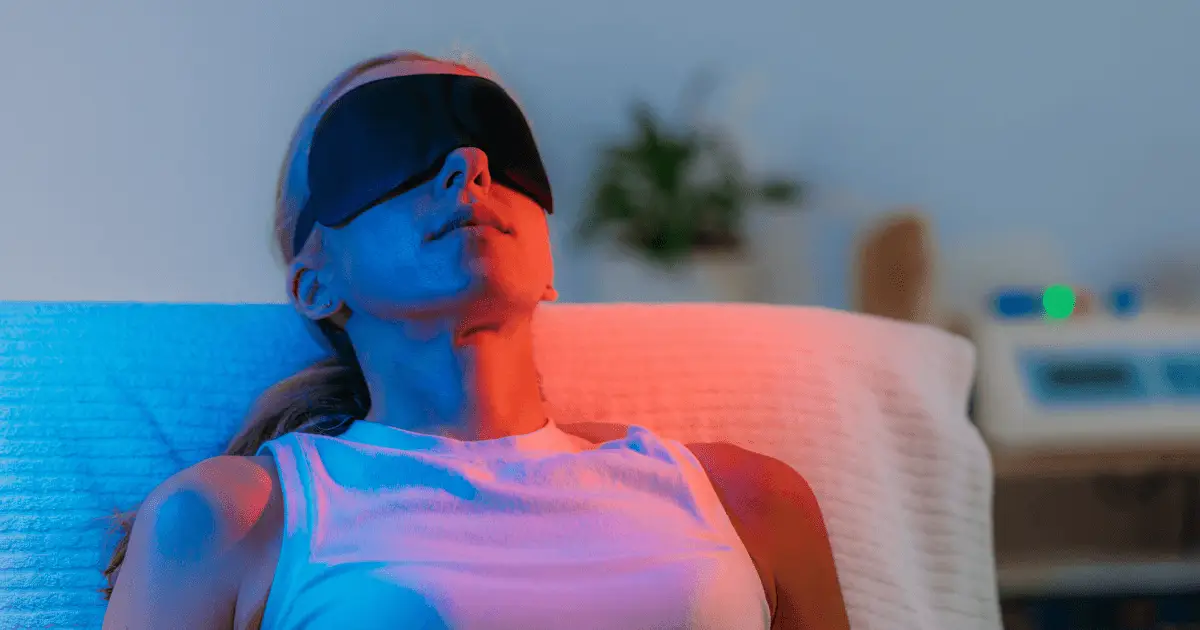 A woman wearing a blindfold, symbolizing color therapy and the exploration of inner vision and perception.