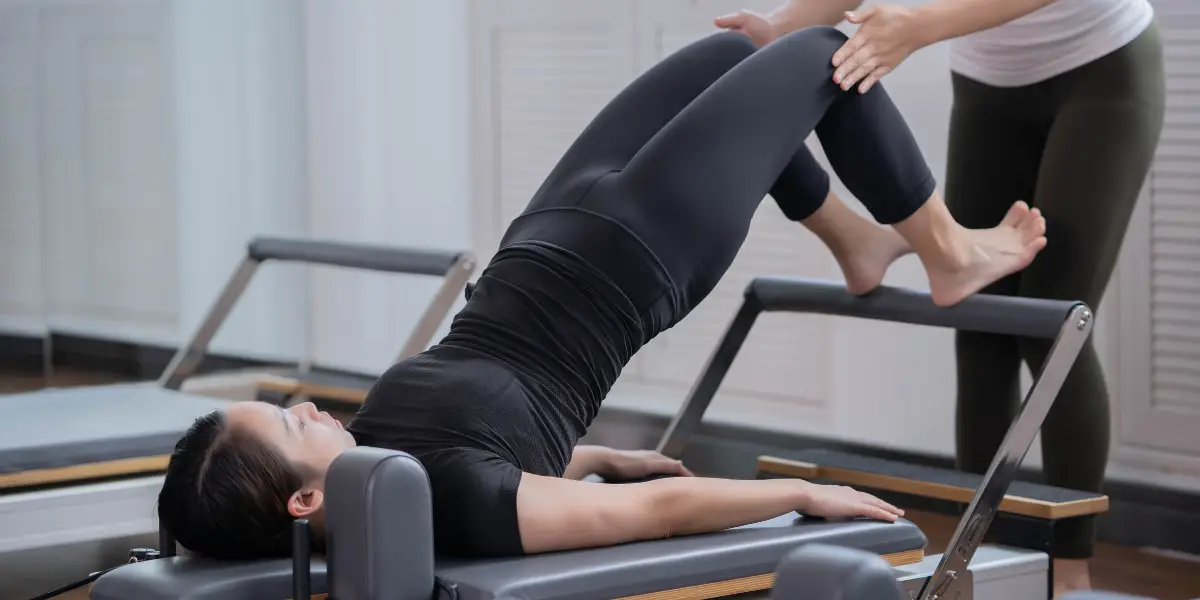 A woman in a back pov doing breathing or meditation