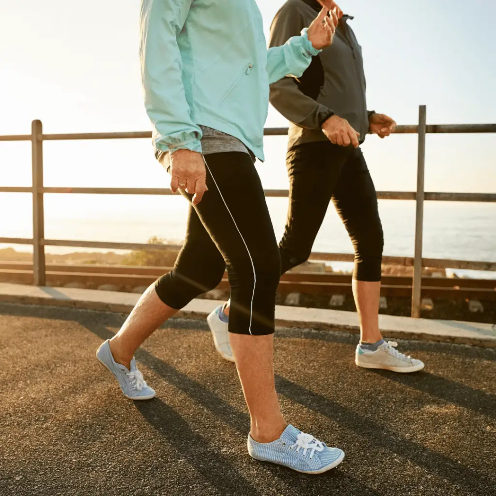 Two individuals jogging on a path during a 30-day walking challenge.