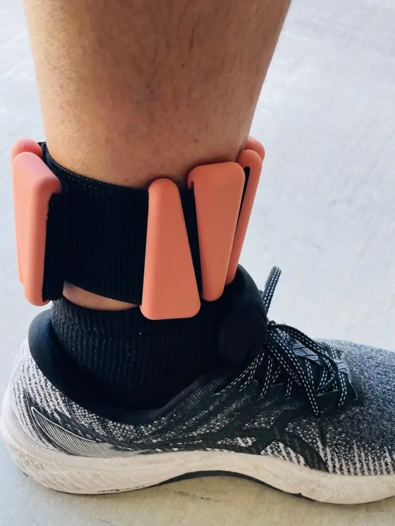 A person wearing ankle weights.