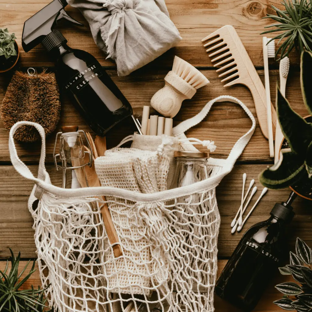 A bag of eco-friendly clean and green products on a wooden table
