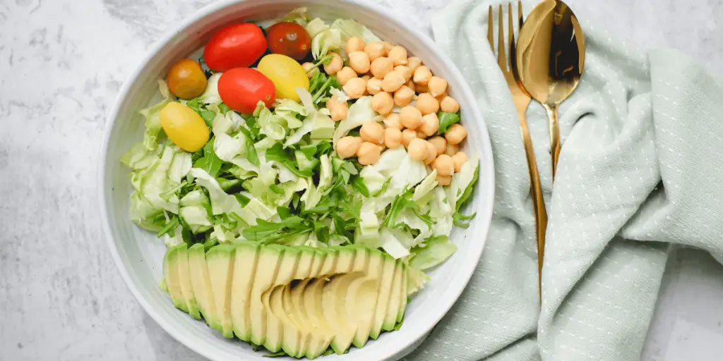 A nutritious salad with avocado, tomatoes, and chickpeas. Perfect for a balanced diet and optimal health.