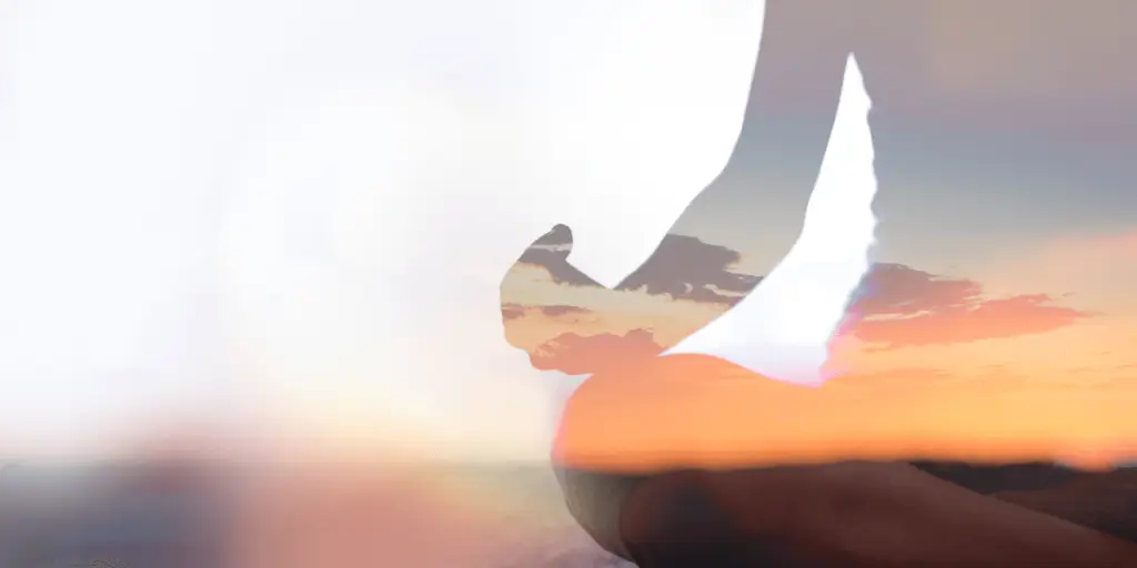 A person meditating in yoga pose at sunset, double exposure, representing sexual energy and understanding.