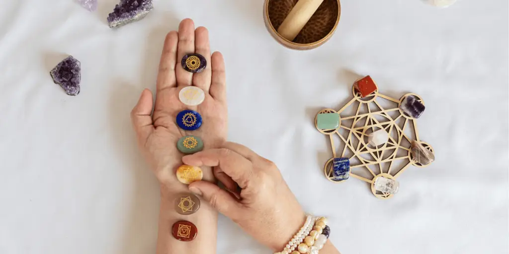 Chakra stones held by person for Reiki Healing with crystals.