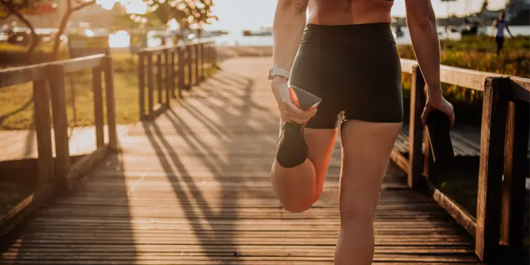 A woman in a sports attire on a wooden bridge, participating in Games for Health.